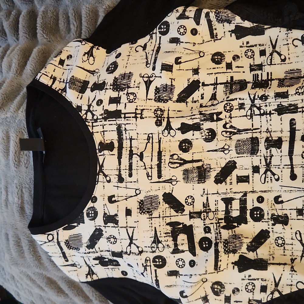 Long sleeve scissors, sewing, button theme shirt.